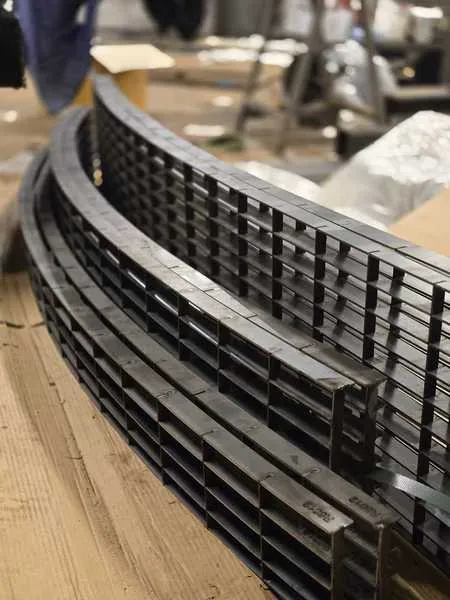 Bespoke curved architectural metal grilles made for Unilever
